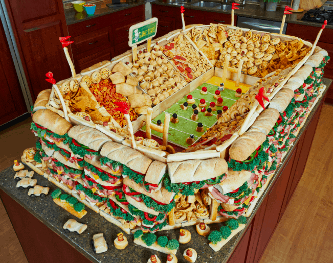 a large platter of food with a football field on it.