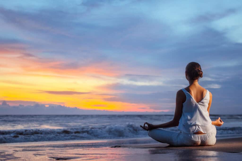 A person practices spiritual coaching meditation