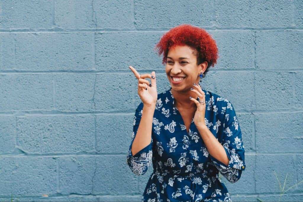 red hair woman pointing