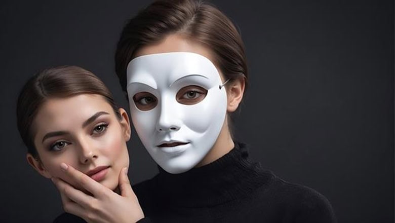 A woman wearing a white mask holds another woman's face beside her, both dressed in black against a dark background.
